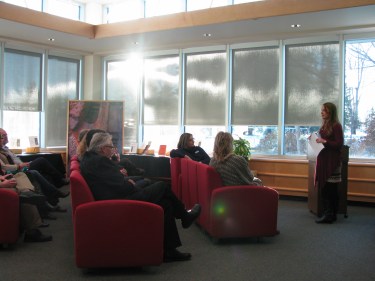 Chelsey Reid, Copyright Officer, introduces speakers at the MHC IP Exhibit in the Southwest Lounge, Vera Bracken Library. 